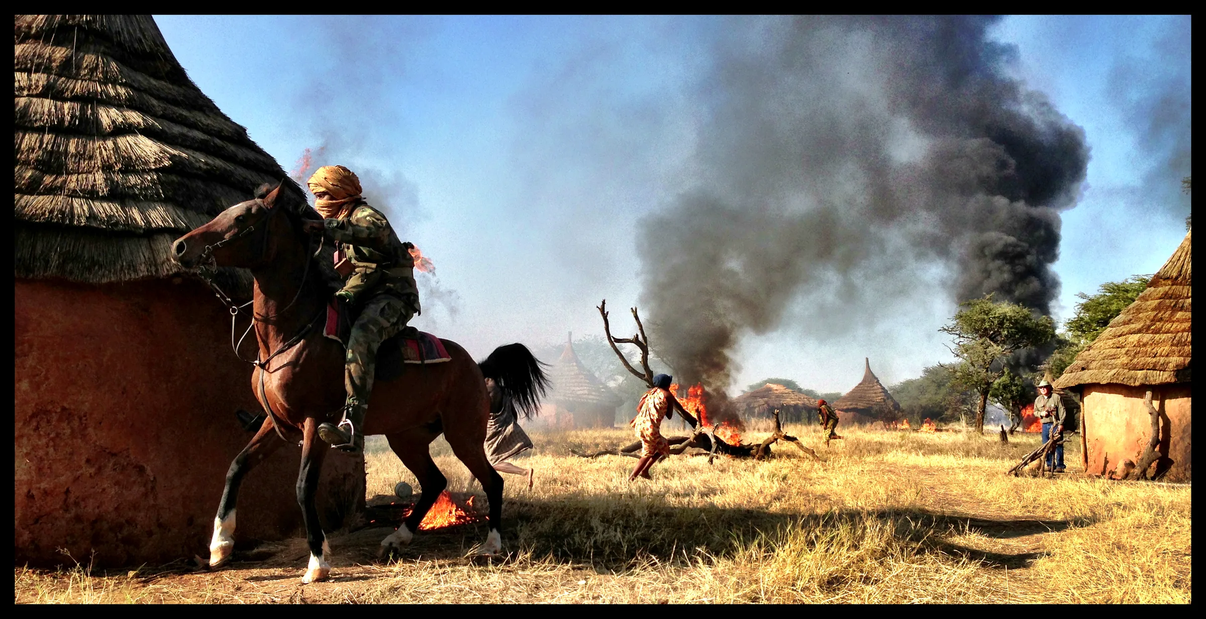 The Good Lie production design — Dinka village burning